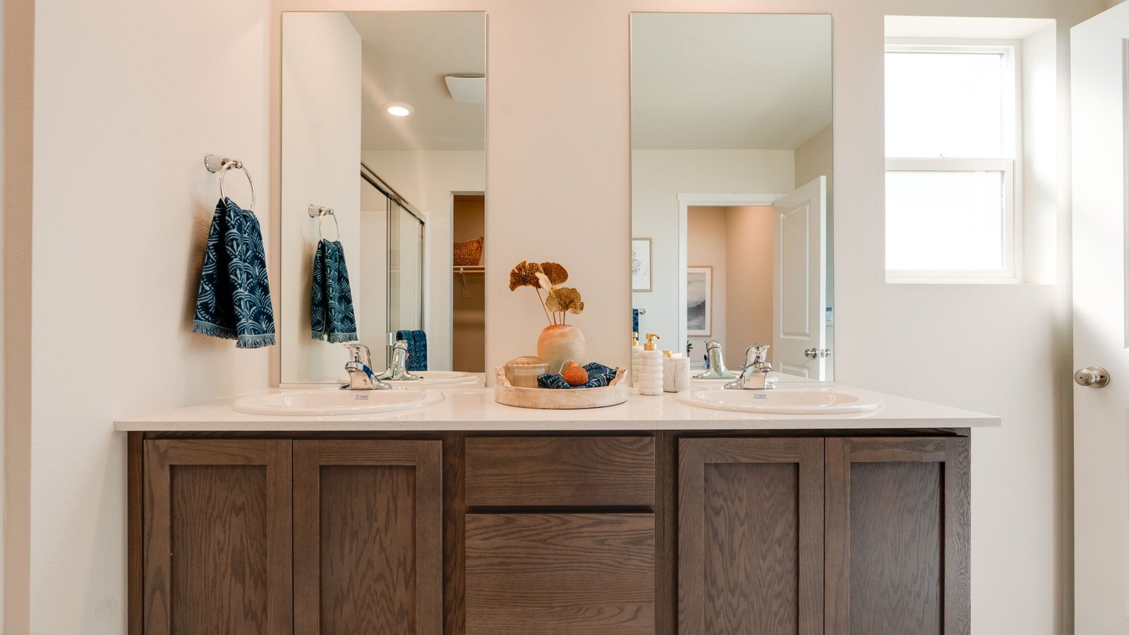 Primary bathroom with quartz counters and a walk-in shower