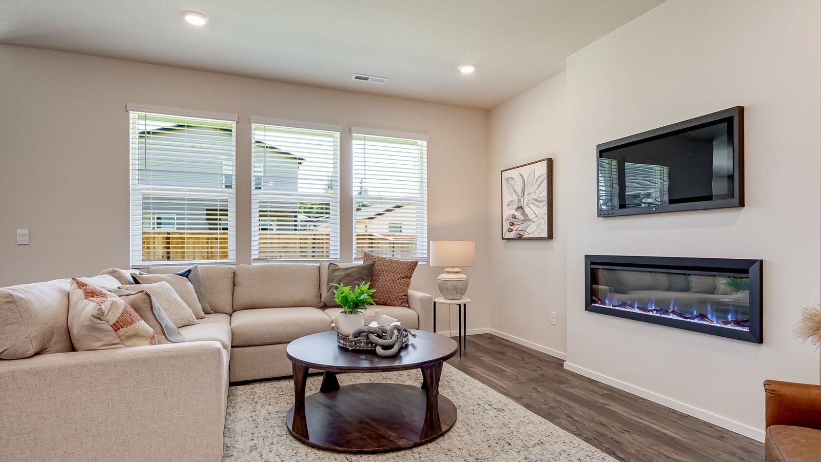 Great room with laminate flooring and an electric fireplace
