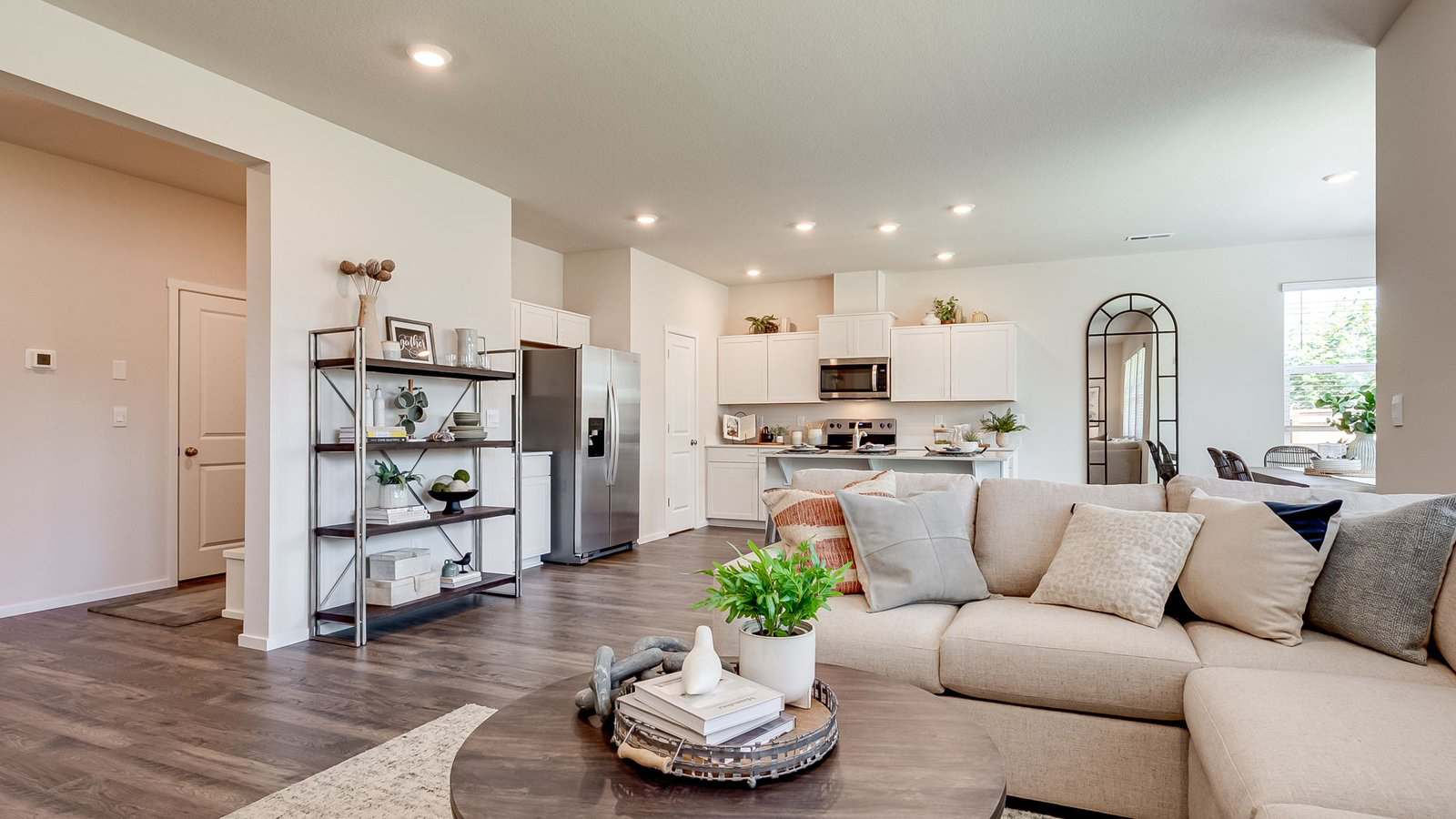 Great room with laminate flooring and an electric fireplace