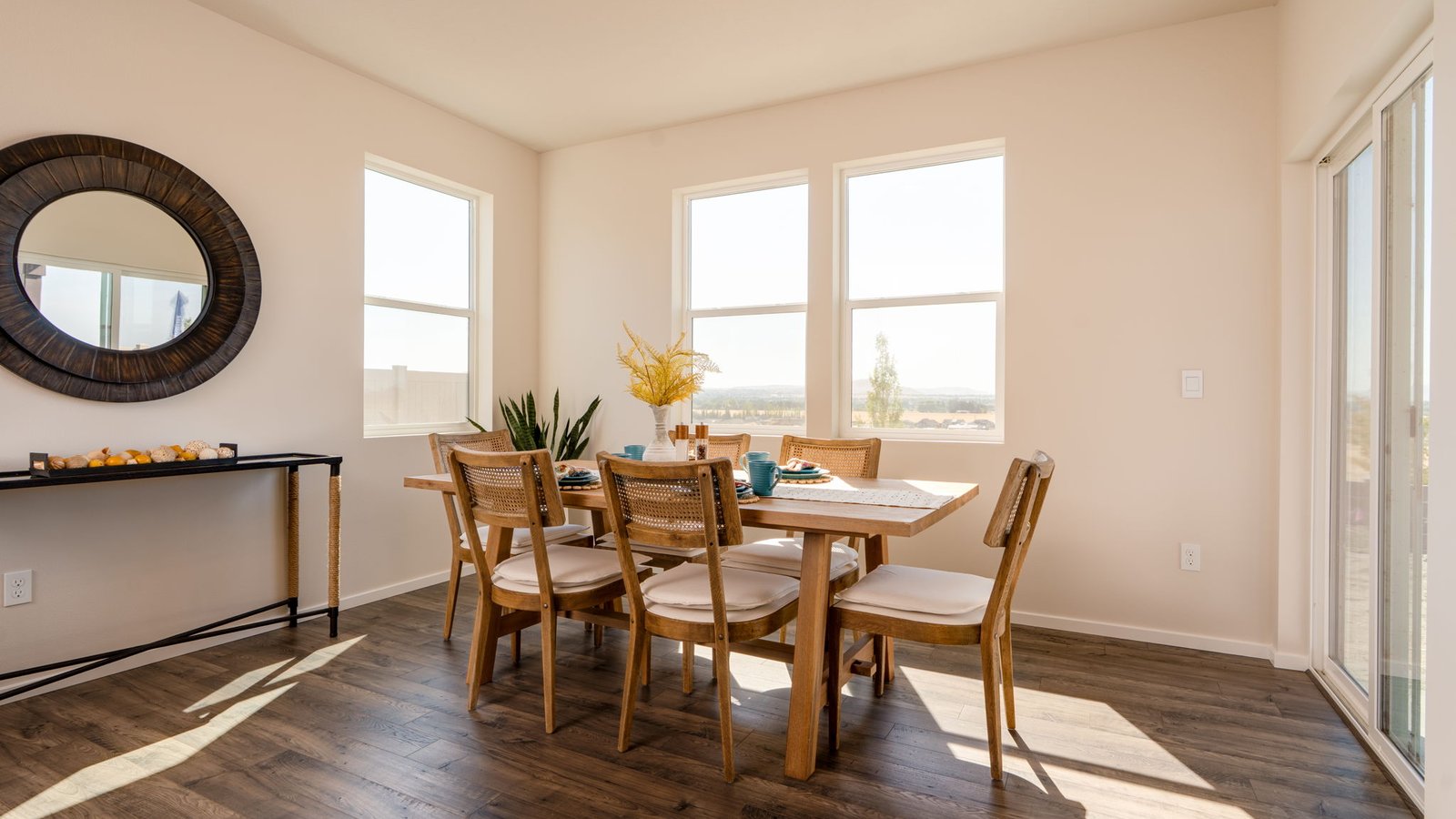 Dining area with a sliding glass door to a fenced backyard