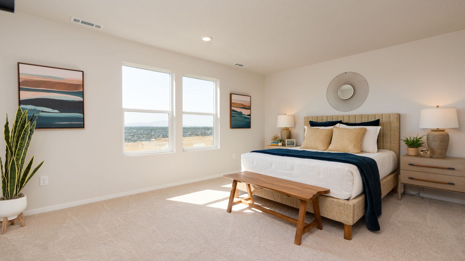 Primary bedroom with wall-to-wall carpet, a walk-in closet and an attached bathroom