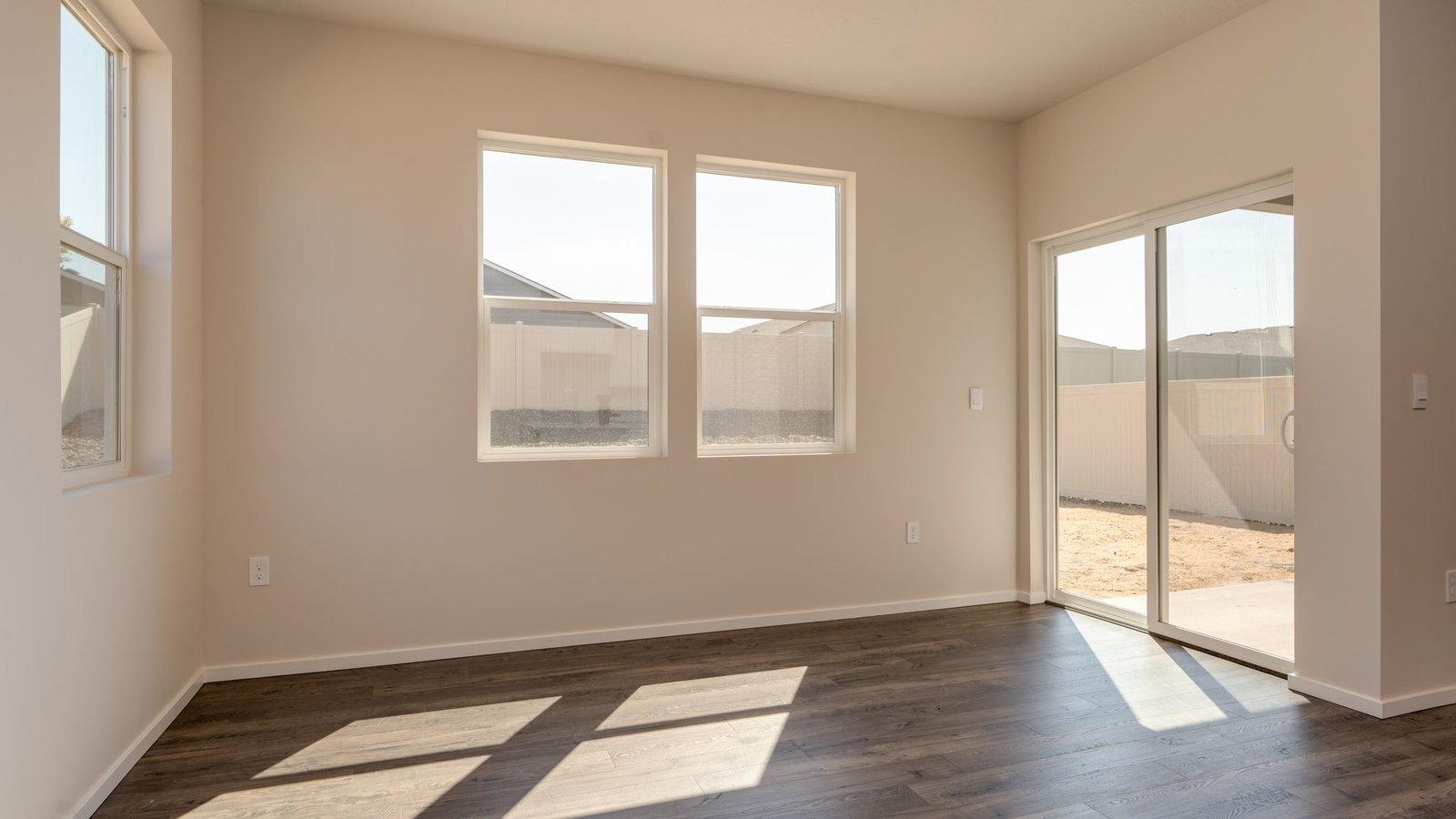 Dining area with a sliding glass door to a fenced backyard