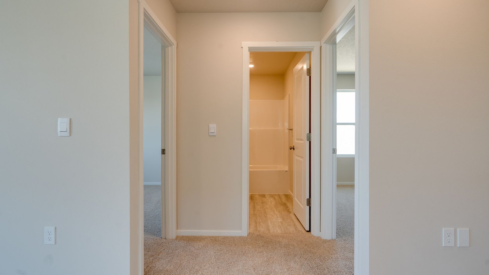 Hallway with wall-to-wall carpet