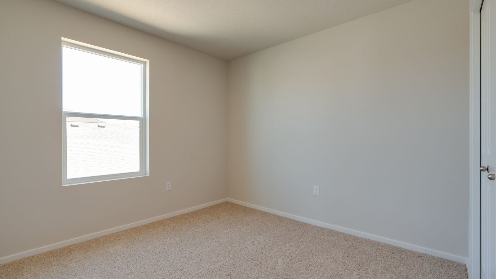 Bedroom with wall-to-wall carpet and a closet
