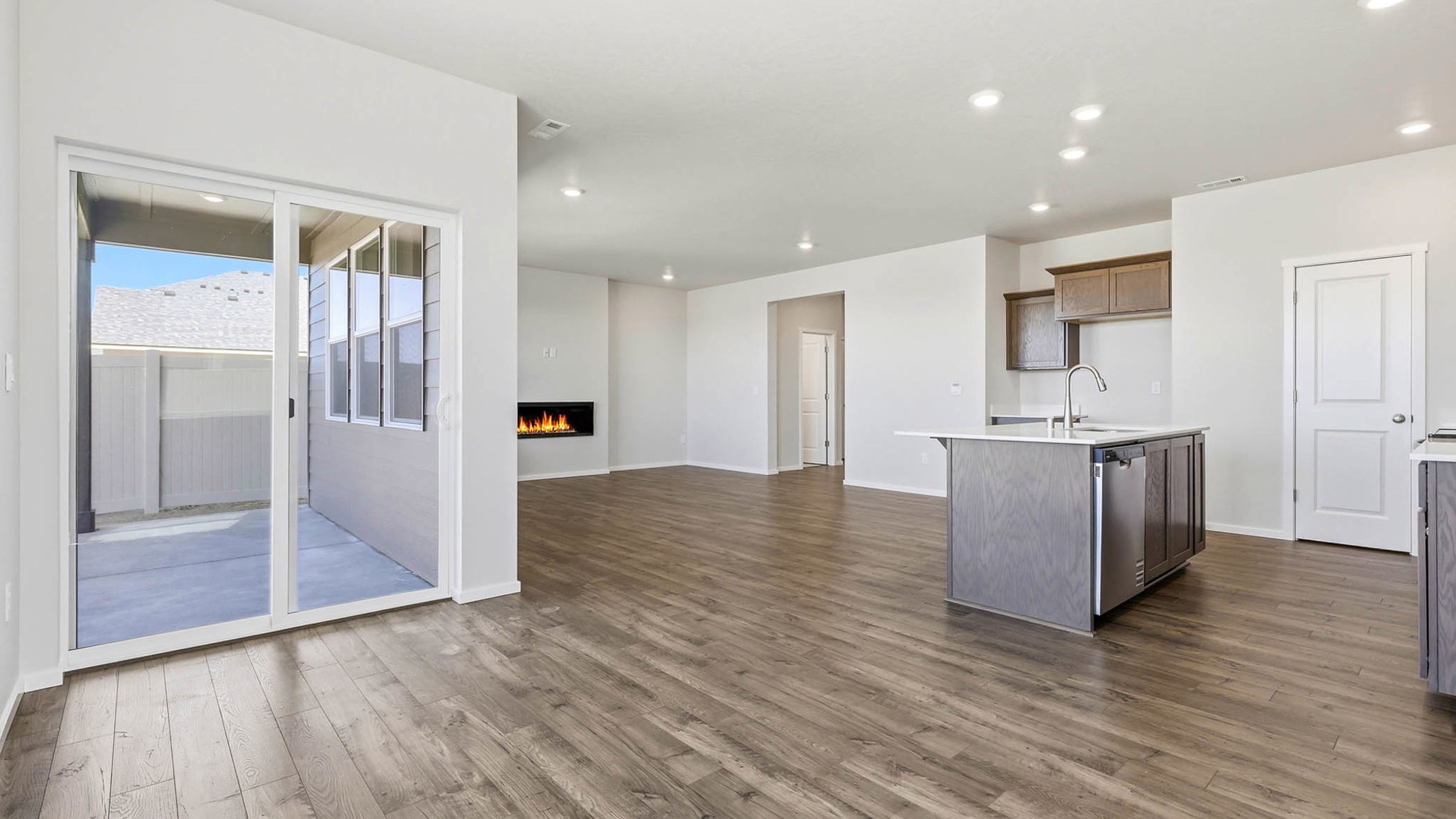 Dining area with a sliding glass door to a fenced backyard