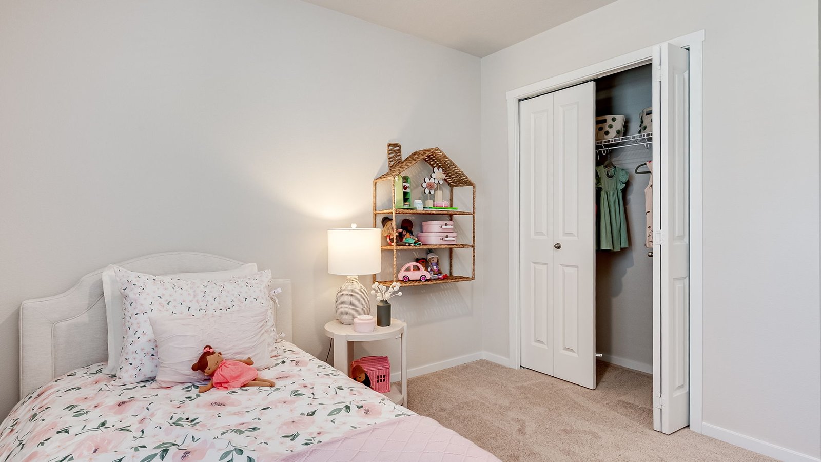 Bedroom with wall-to-wall carpet and a closet