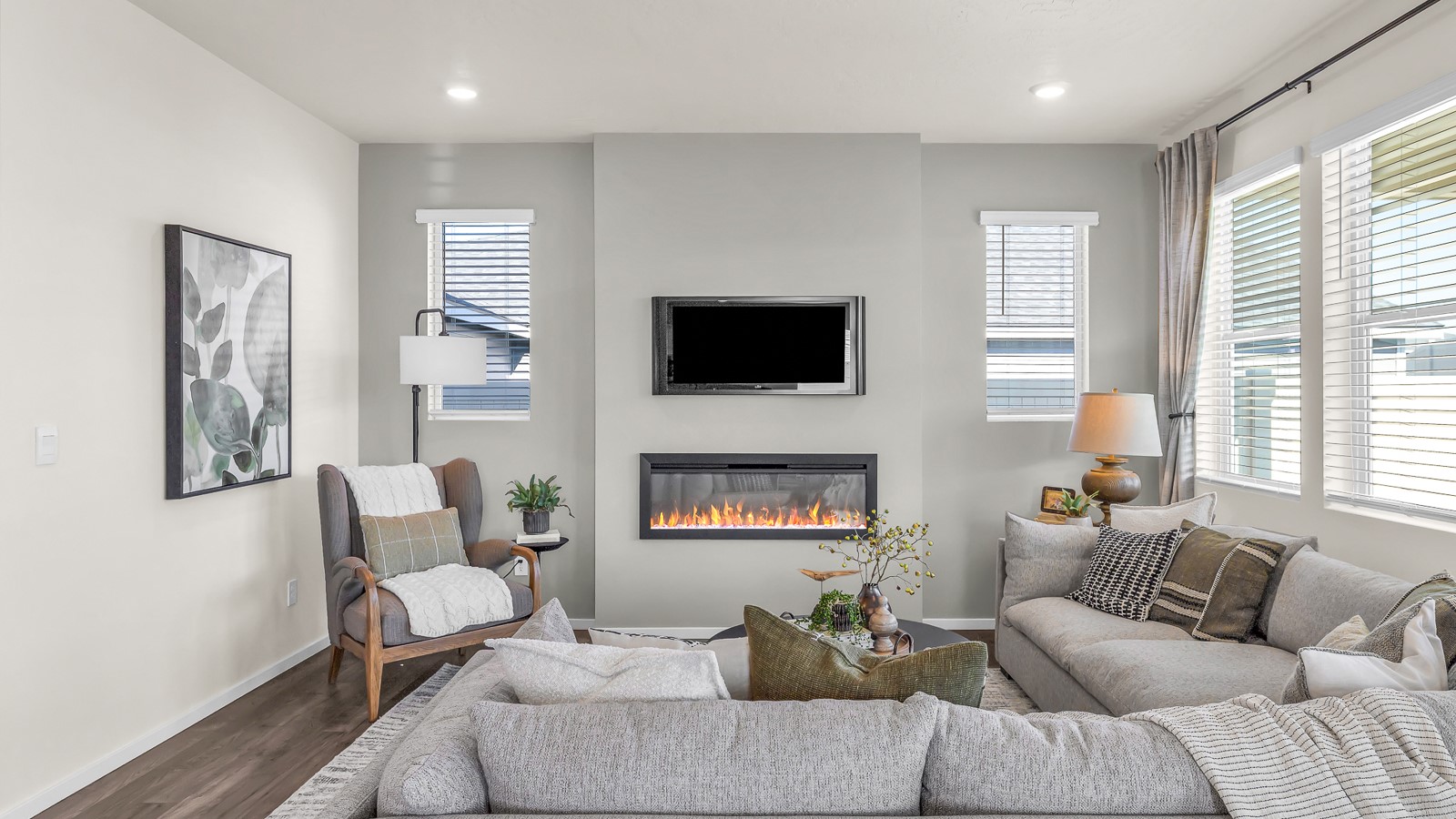 Great room with laminate flooring and an electric fireplace