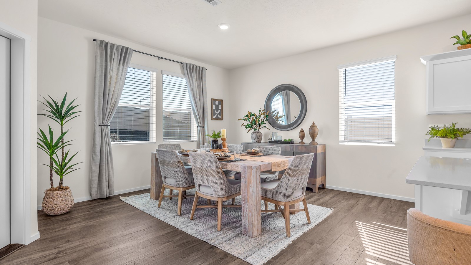 Dining area with a sliding glass door to a fenced backyard