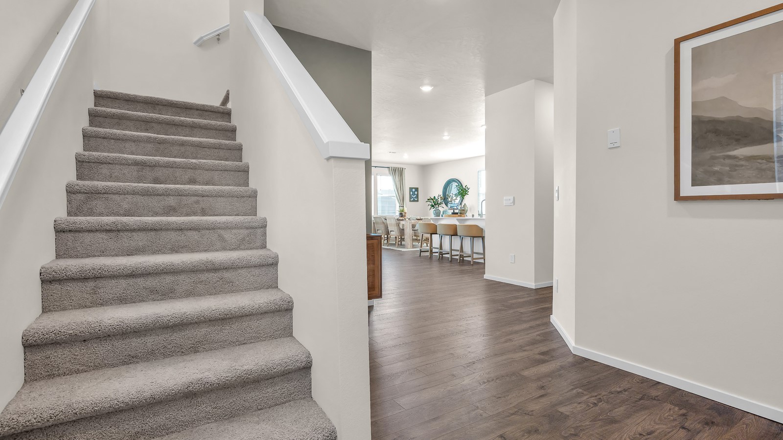 Entryway with a coat closet and laminate flooring