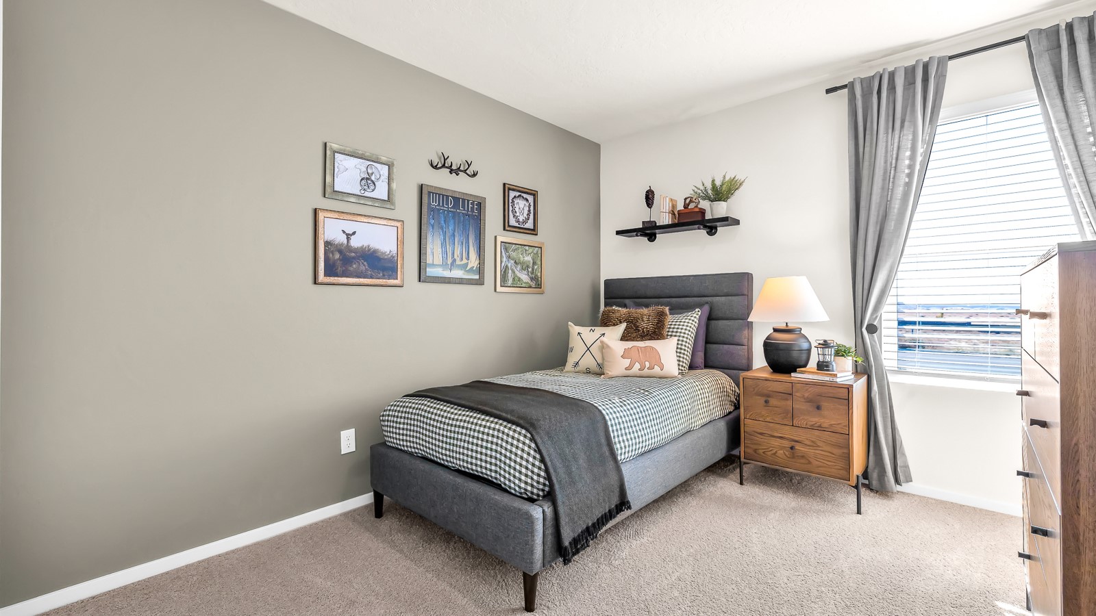 Bedroom with wall-to-wall carpet and a closet