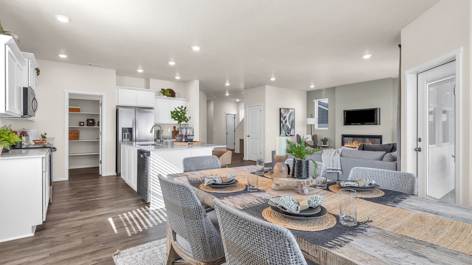 Great room with laminate flooring and an electric fireplace
