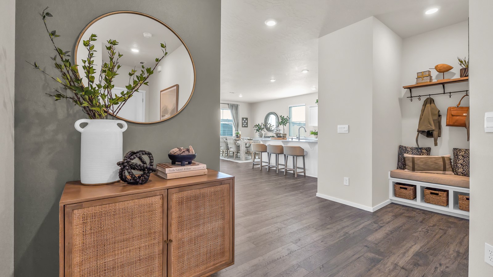 Entryway with a coat closet and laminate flooring