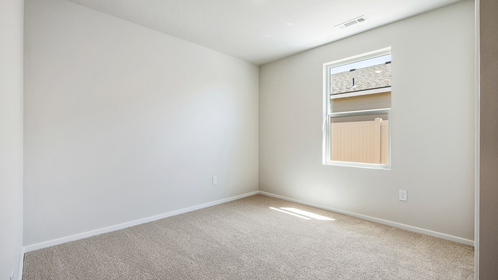 Bedroom with wall-to-wall carpet and a closet