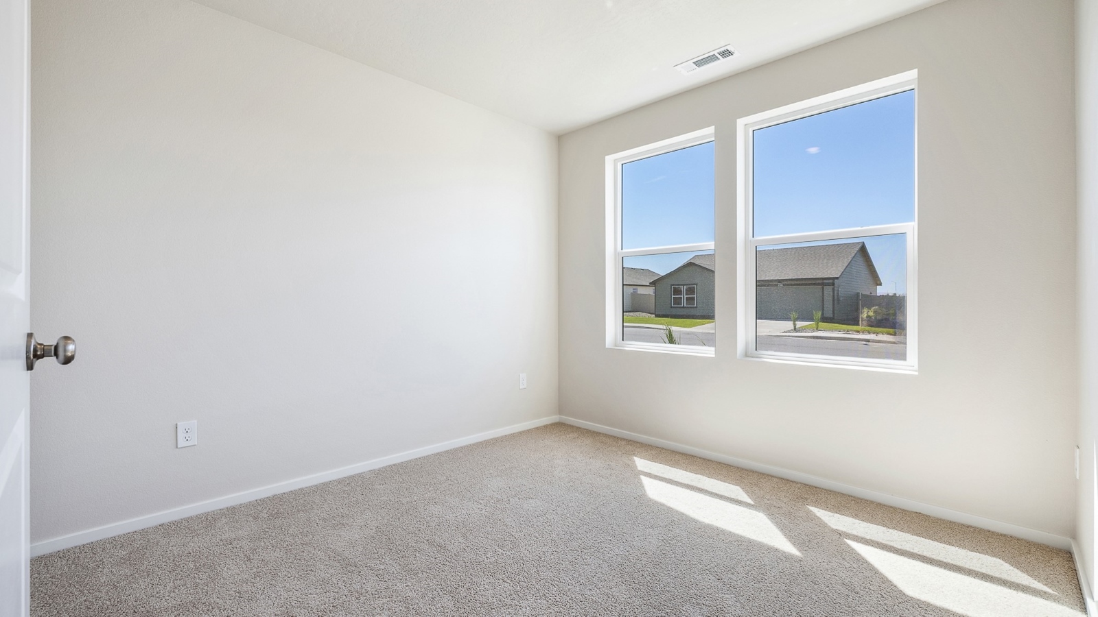 Bedroom with wall-to-wall carpet and a closet