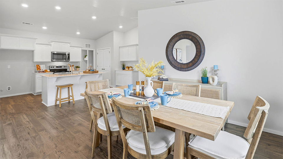 Dining area with a sliding glass door to a fenced backyard