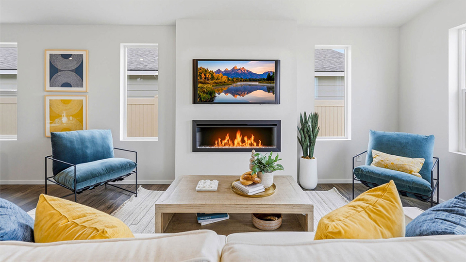 Great room with laminate flooring and an electric fireplace and vaulted ceilings
