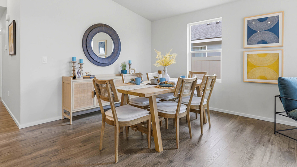 Dining area with a sliding glass door to a fenced backyard