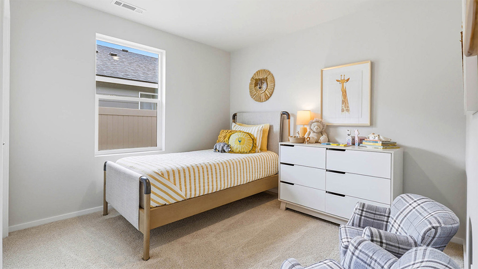 Bedroom with wall-to-wall carpet and a closet
