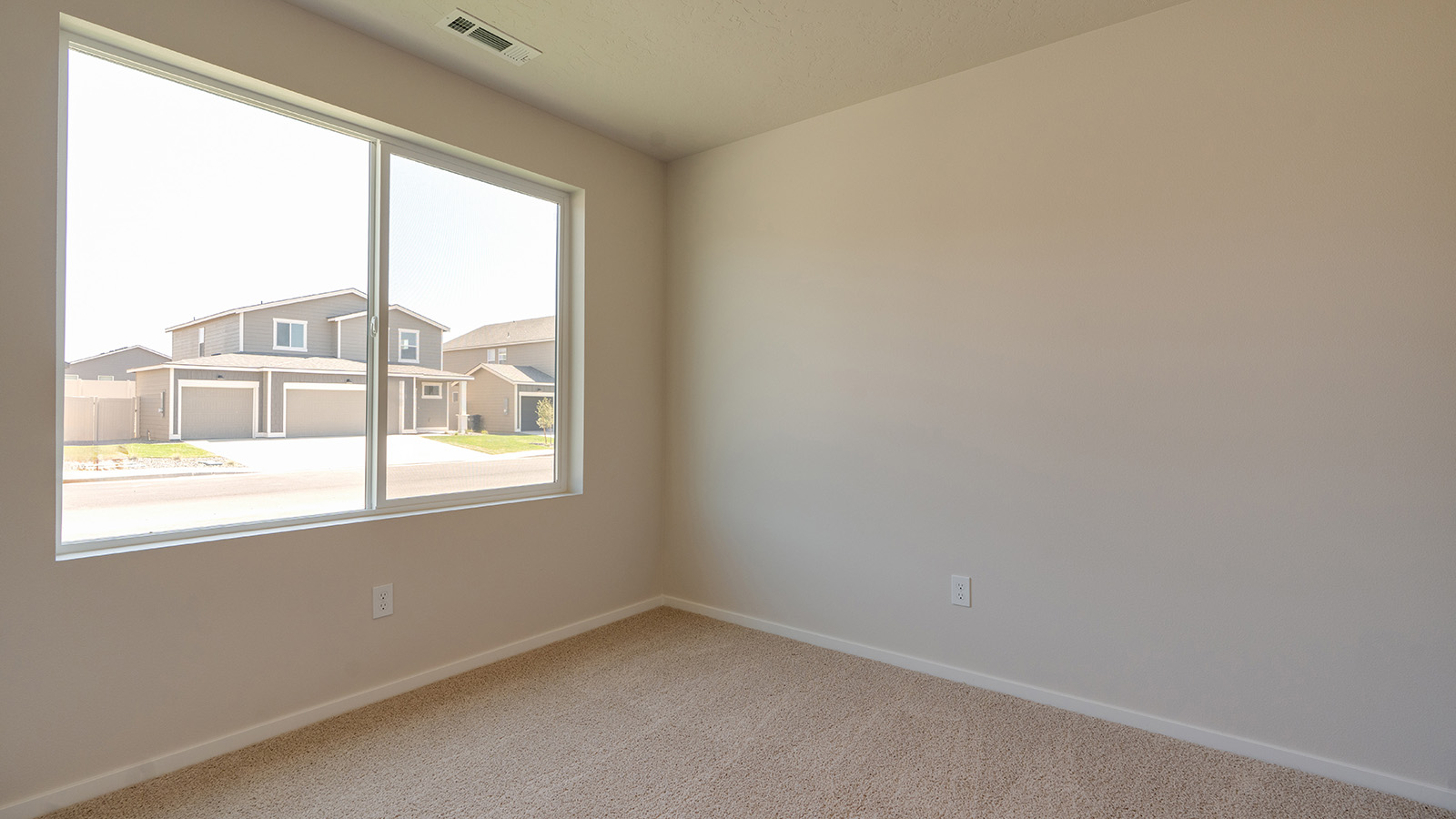 Bedroom with wall-to-wall carpet and a closet