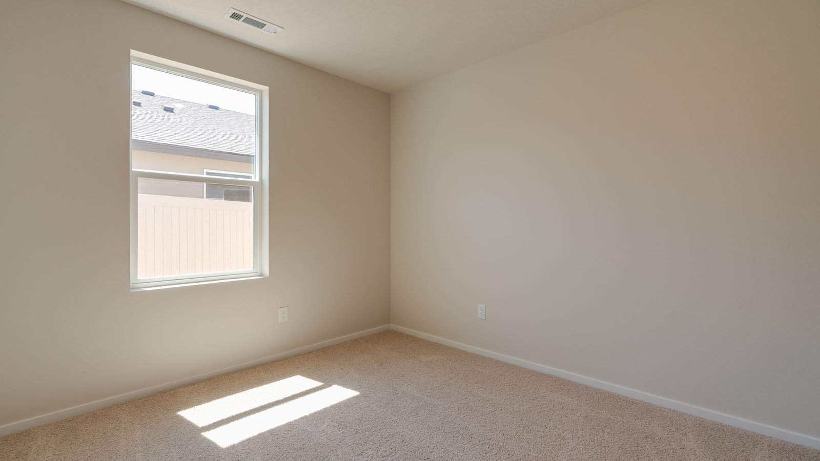 Bedroom with wall-to-wall carpet and a closet