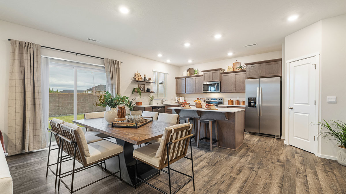 Dining area with a sliding glass door to a fenced backyard