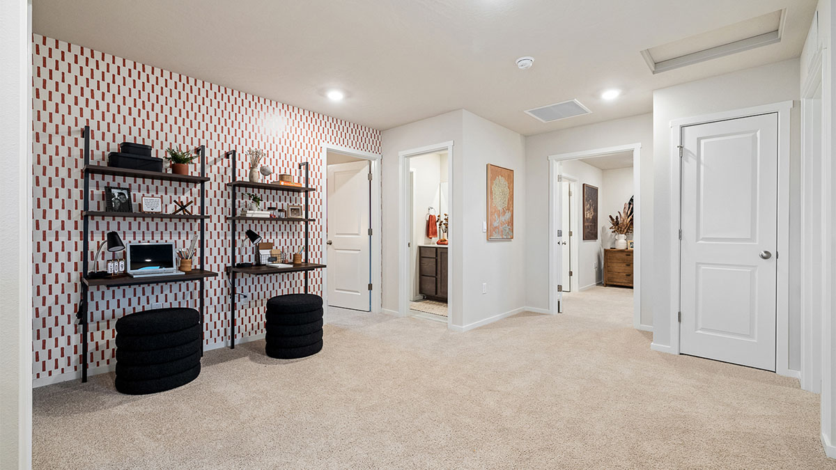 Hallway with wall-to-wall carpet