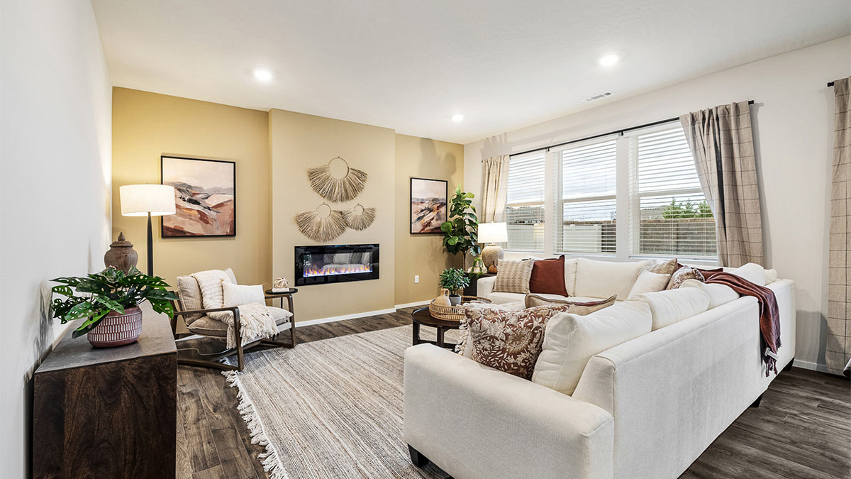 Great room with laminate flooring and an electric fireplace