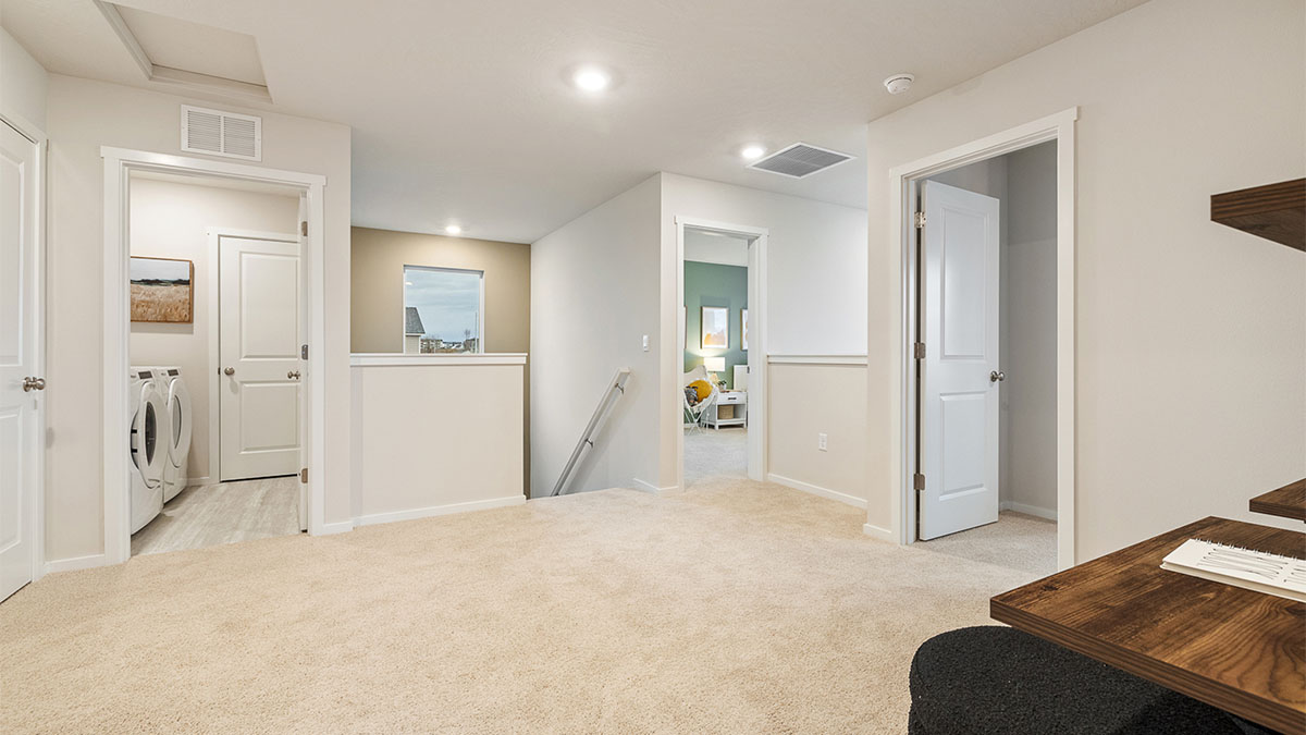 Hallway with wall-to-wall carpet