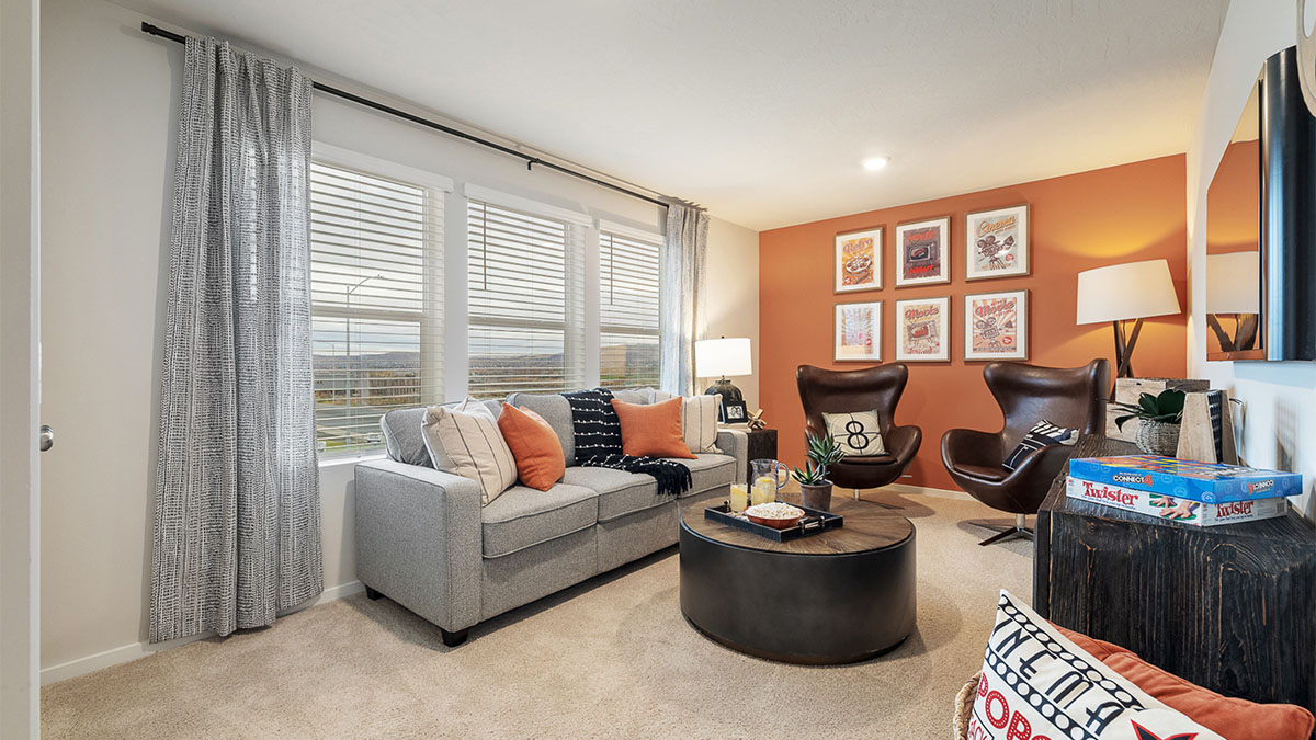 Bedroom staged as an office with wall-to-wall carpet and a closet