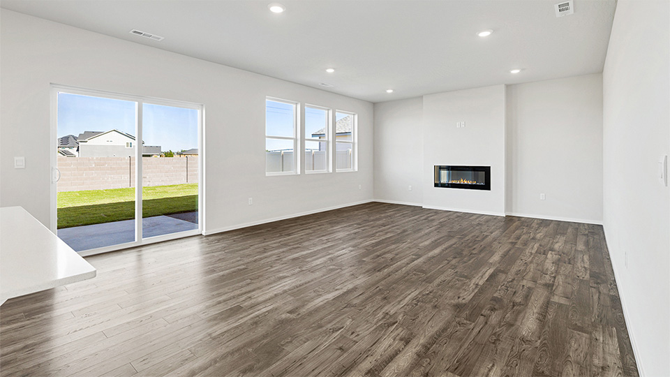 Great room with laminate flooring and an electric fireplace