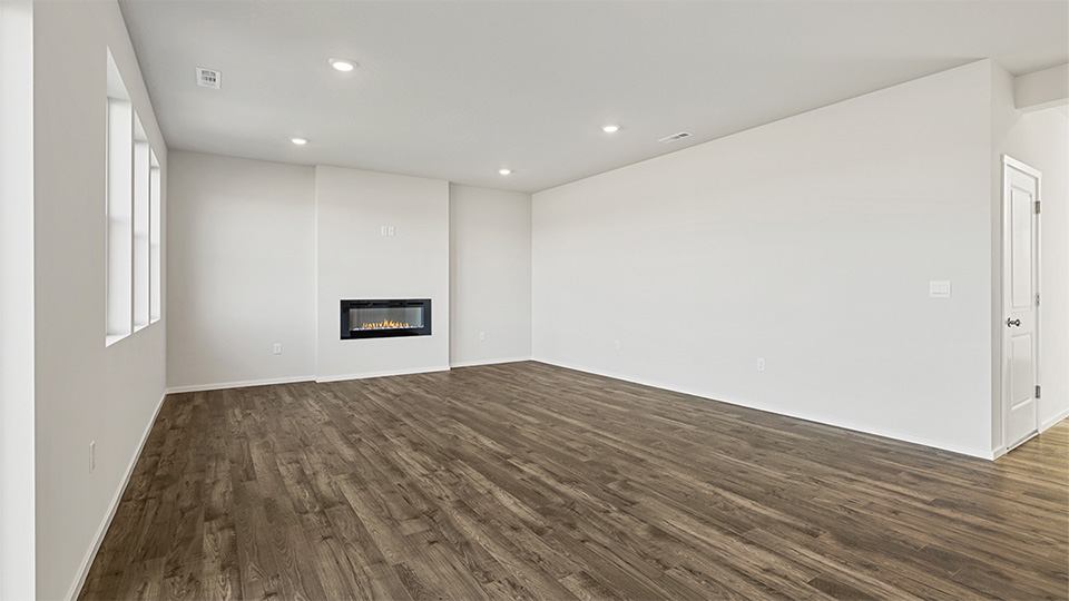 Great room with laminate flooring and an electric fireplace