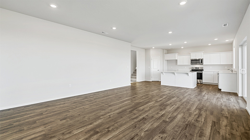 Great room with laminate flooring and an electric fireplace
