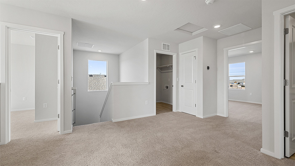 Hallway with wall-to-wall carpet
