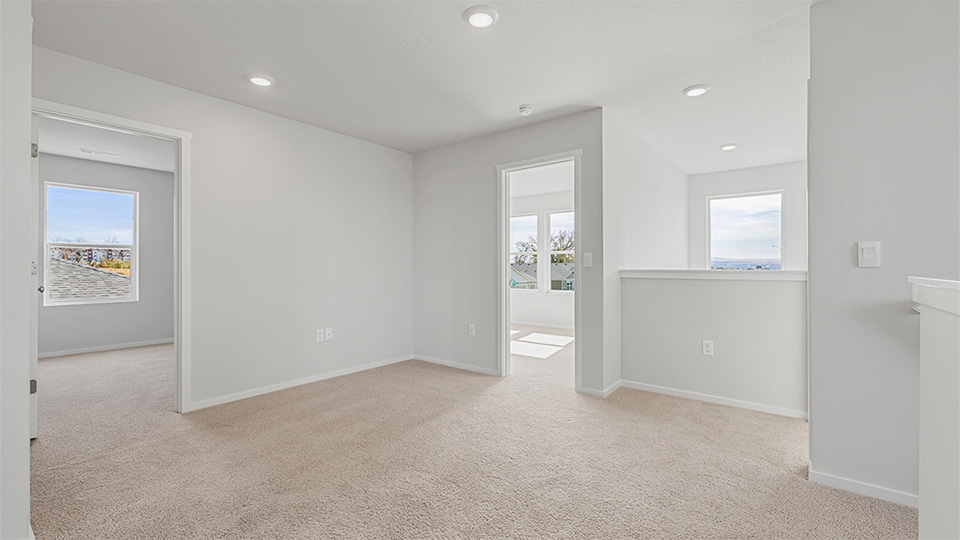 Hallway with wall-to-wall carpet