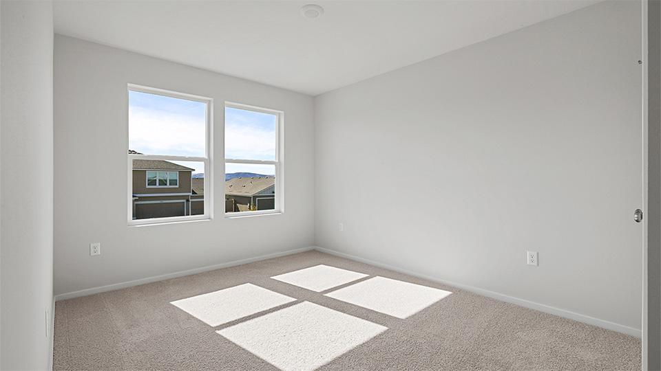 Bedroom with wall-to-wall carpet and a closet