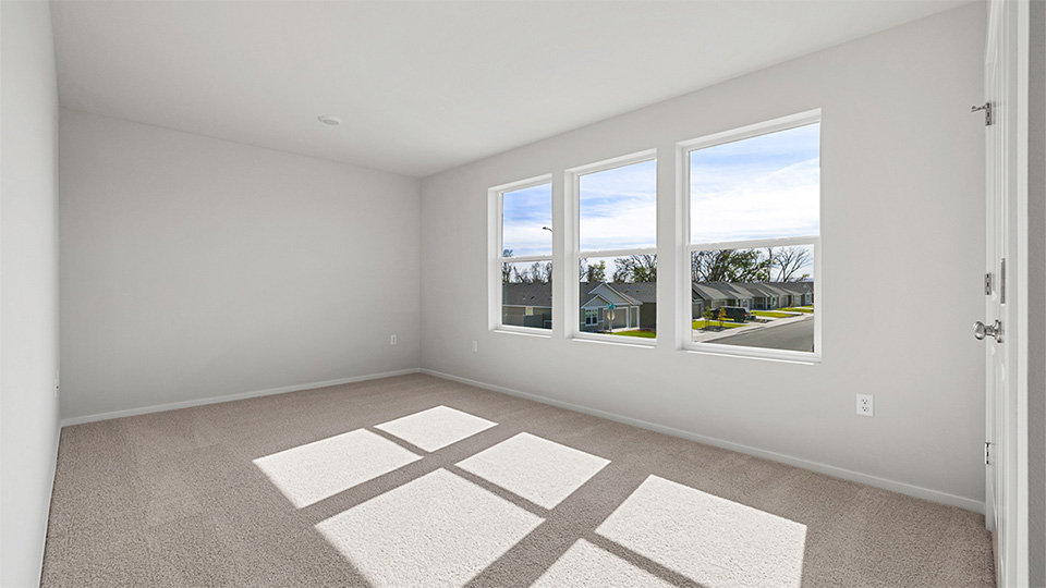 Bedroom with wall-to-wall carpet and a closet