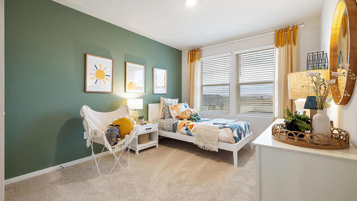 Child’s bedroom with wall-to-wall carpet and a closet