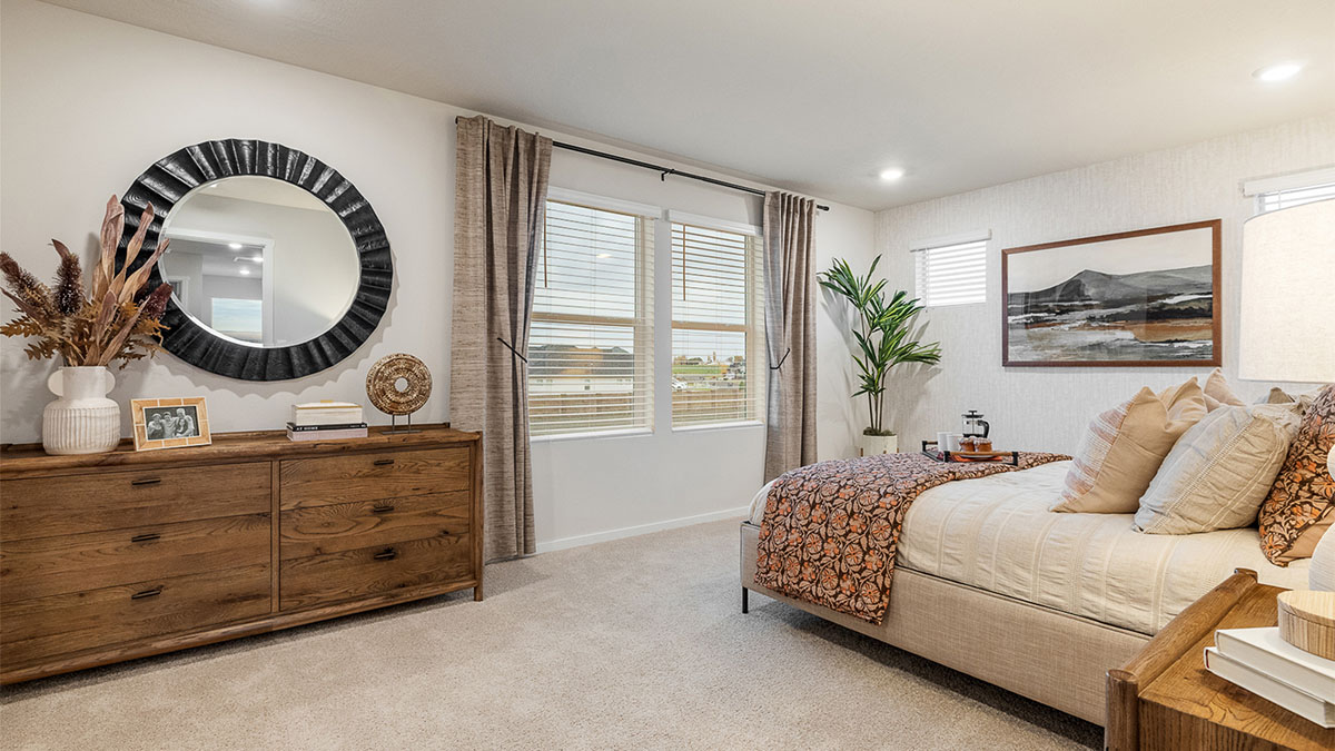 Primary bedroom with wall-to-wall carpet, a walk-in closet and an attached bathroom