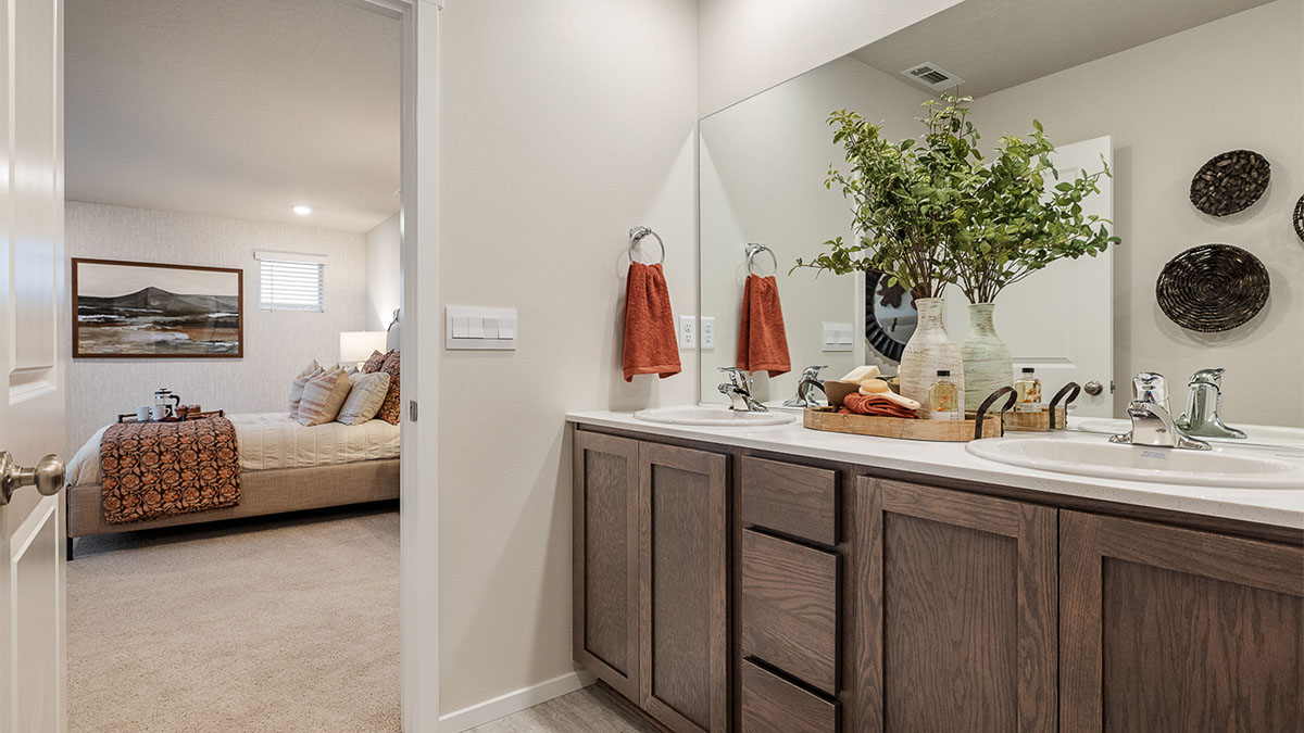 Primary bathroom with quartz counters and a walk-in shower