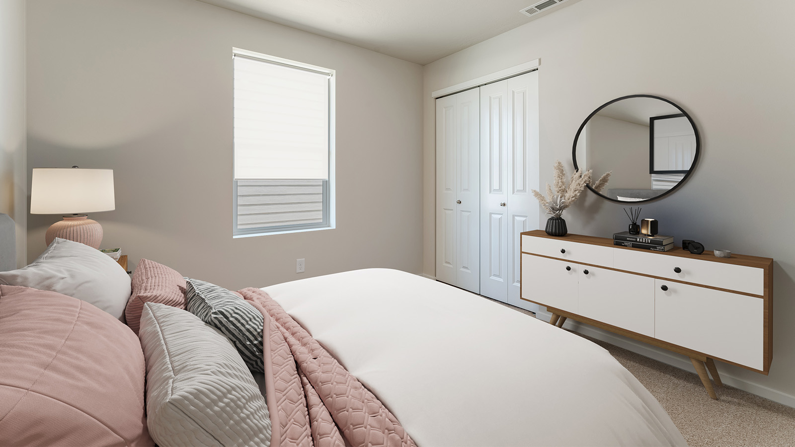 Bedroom with wall-to-wall carpet and a closet