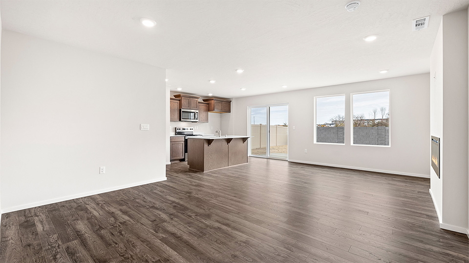 Great room with laminate flooring and an electric fireplace