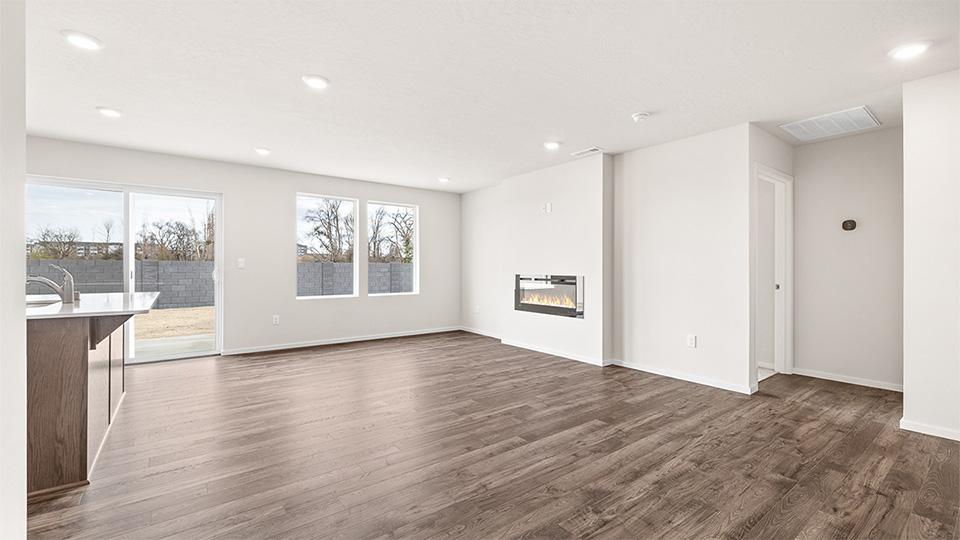 Great room with laminate flooring and an electric fireplace