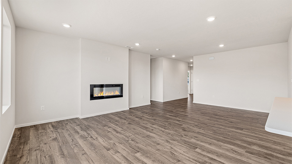 Great room with laminate flooring and an electric fireplace