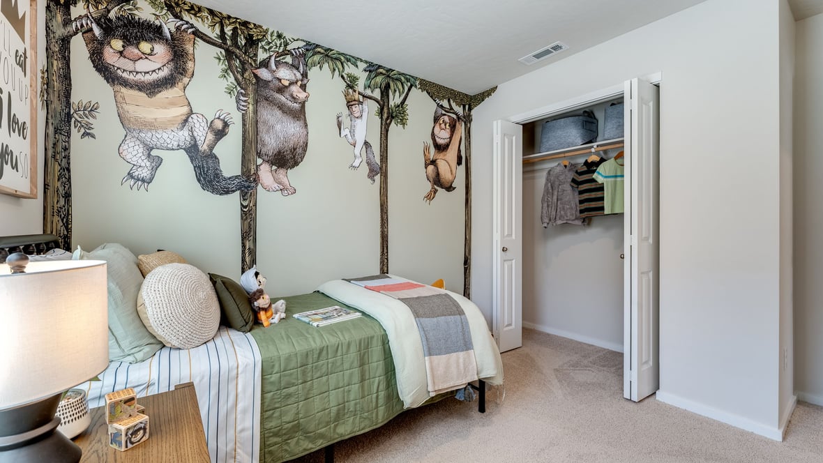 Bedroom with wall-to-wall carpet and a closet