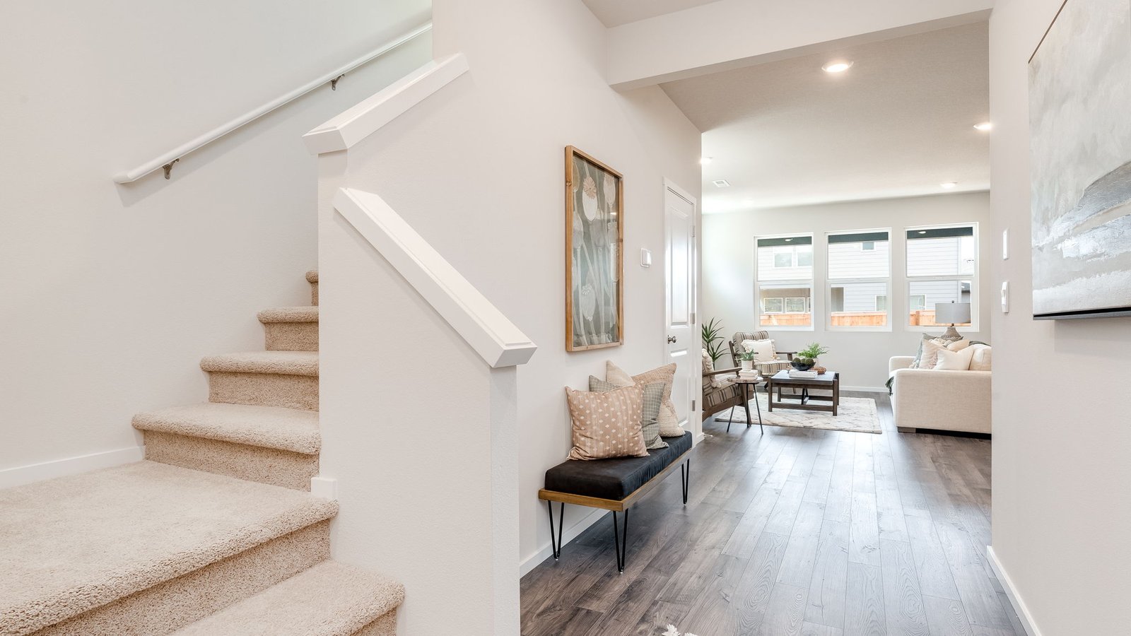 Entryway with a coat closet and laminate flooring