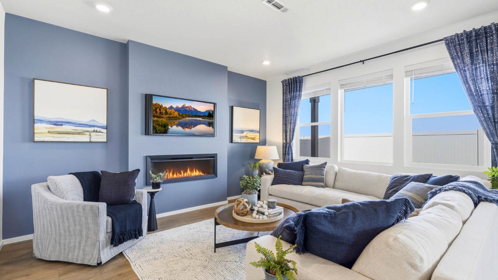 Great room with laminate flooring and an electric fireplace