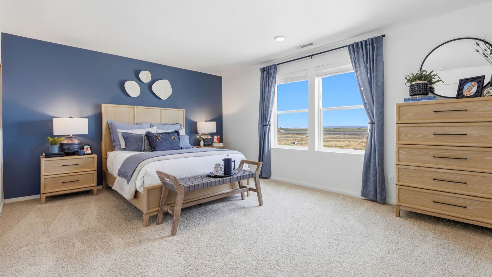 Primary bedroom with wall-to-wall carpet, a walk-in closet and an attached bathroom