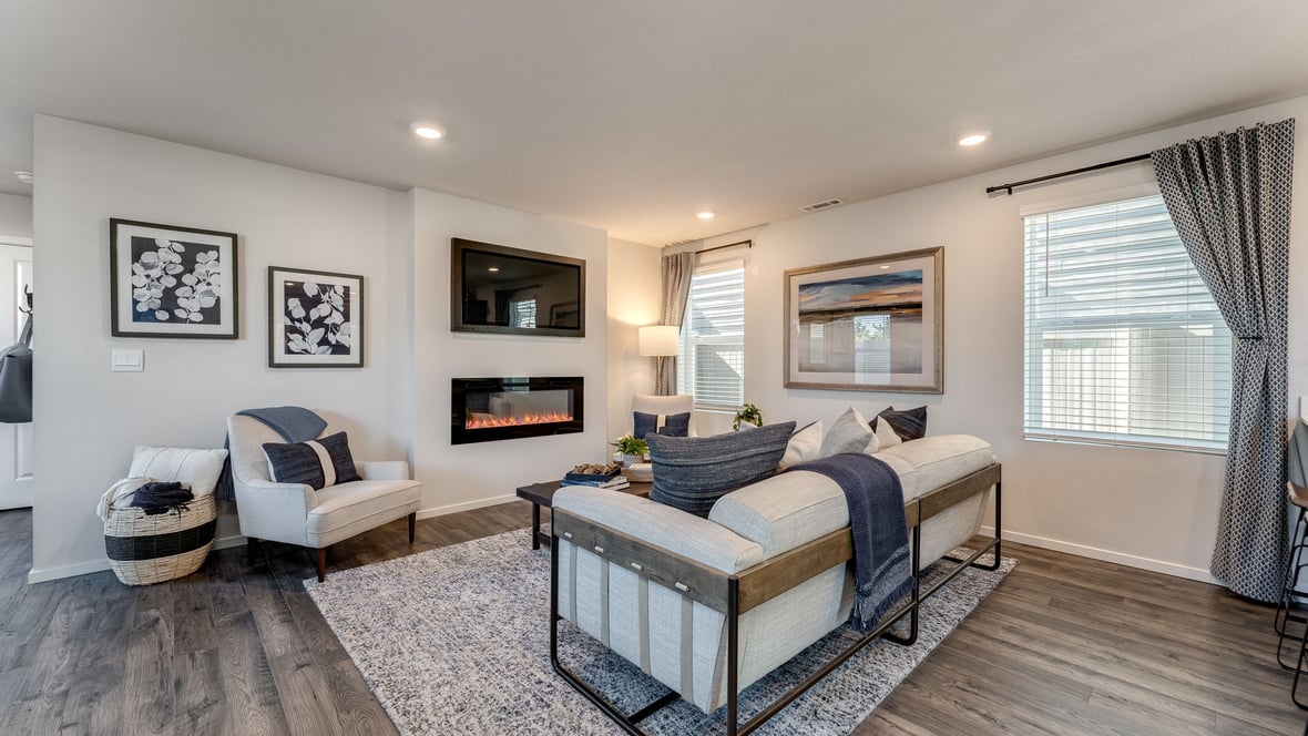 Great room with laminate flooring and an electric fireplace