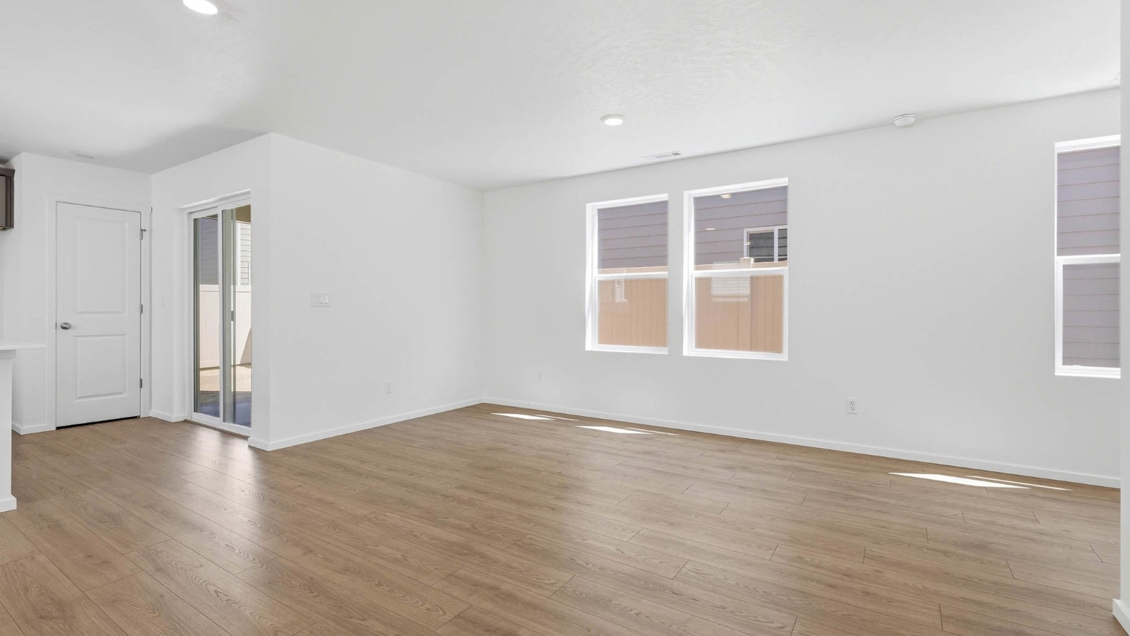 Dining area with a sliding glass door to a fenced backyard