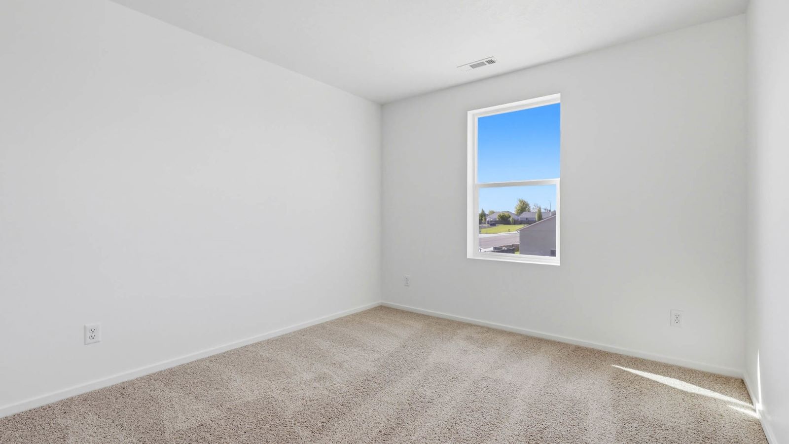 Bedroom with wall-to-wall carpet and a closet